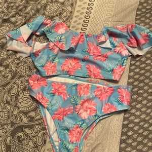 Girls’ Size 8 2 piece pink, light blue, and green swimsuit. Never been worn.